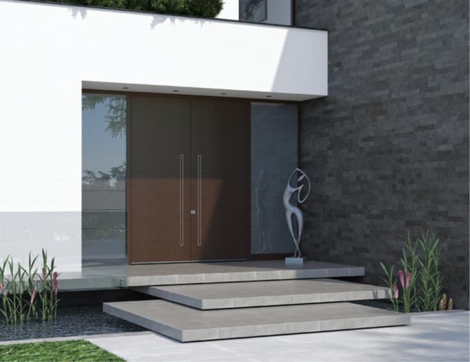 Minimalističen vhod v hišo Pirnar z zračnimi obsvetlobami. 