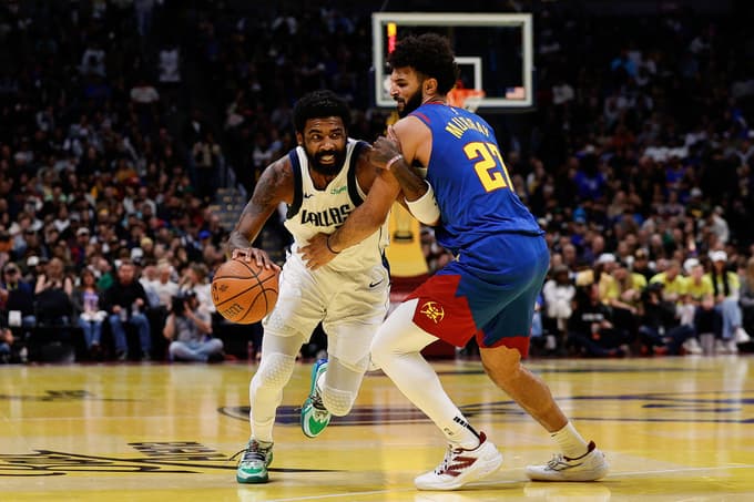 Nov 22, 2024; Denver, Colorado, USA; Dallas Mavericks guard Kyrie Irving (11) drives to the basket against Denver Nuggets guard Jamal Murray (27) in the third quarter at Ball Arena. Mandatory Credit: Isaiah J. Downing-Imagn Images