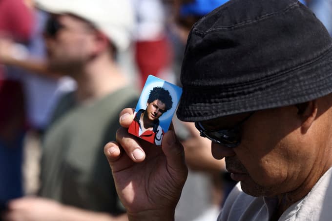 A faithful holds a picture of Carlo Acutis, as Pope Leo XIV leads a Holy Mass for the canonisation of Carlo Acutis, a British-born Italian boy who will become the first millennial to be made a Catholic saint, and Pier Giorgio Frassati, in St. Peter's Square at the Vatican, September 7, 2025. REUTERS/Matteo Minnella TPX IMAGES OF THE DAY