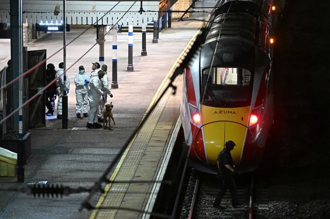 Police officers and a dog handler work on the platform alongside an LNER Azuma train at Huntingdon Station in Huntingdon, eastern England, on November 1, 2025, following a stabbing on a train. UK police said they had arrested two suspects Saturday as "a number of people" were taken to hospital after a stabbing on a train in Cambridgeshire, eastern England. "We are currently responding to an incident on a train to Huntingdon where multiple people have been stabbed," British Transport Police said on X, adding that "two people have been arrested".,Image: 1049731800, License: Rights-managed, Restrictions:, Model Release: no