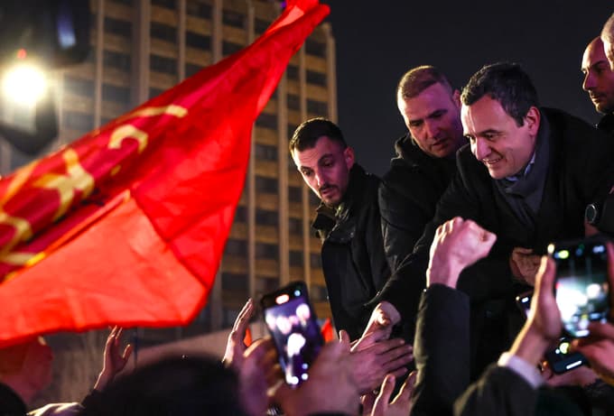 epa12616400 Acting Prime Minister of Kosovo and leader of Vetevendosje (LVV) party Albin Kurti (R), greets supporters in Pristina, Kosovo, 28 December 2025. Preliminary results indicated a strong performance for incumbent Kurti's party, though the final seat count will determine if he can secure the majority needed to form a new government. EPA/GEORGI LICOVSKI