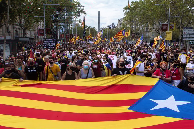 epa09461477 A big pro-independence flag is seen during a demonstration organized by CDR on occasion of the Day of Catalonia, 'Diada', in Barcelona, Catalonia, Spain, 11 September 2021. The Diada is celebrated annually on 11 September and marks the fall of Barcelona during the War of the Spanish Succession in 1714. EPA/Enric Fontcuberta 