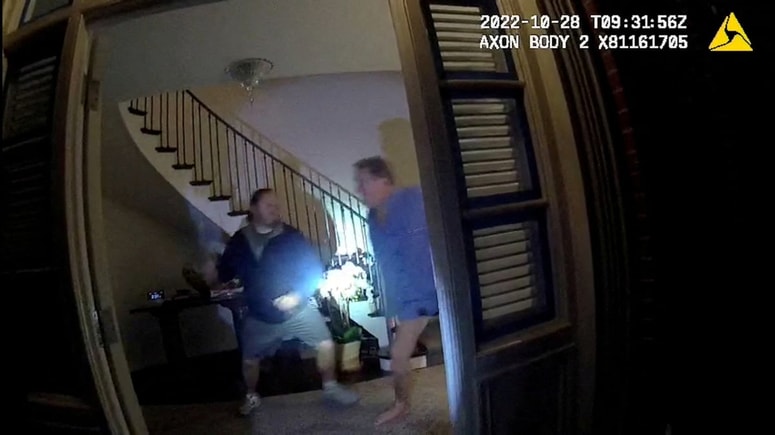 A screenshot from a police body camera video shows David DePape lifting a hammer to strike Paul Pelosi, the husband of then-House Speaker Nancy Pelosi, in the couple's house on October 28, 2022, in San Francisco, California, U.S. San Francisco District Attorney/Handout via REUTERS THIS IMAGE HAS BEEN SUPPLIED BY A THIRD PARTY REFILE - CORRECTING SOURCE OF THE PICTURE TPX IMAGES OF THE DAY 