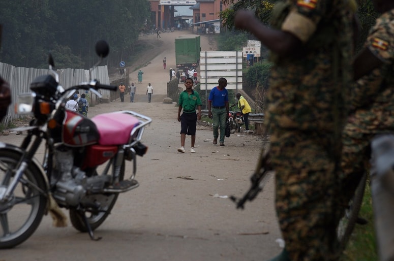School going pupils from the Democratic Republic of Congo (DRC) are seen crossing the Mpondwe border point separating Uganda and the DRC on August 14, 2019. Every day at dawn, Doneka Kabowo, a Congolese teenager, walks miles into the jungle, with the threat of armed militiamen who roam the area, to go to school across the border in Uganda. But for some time now, another obstacle has developed for the 15-year-old and hundreds of schoolchildren who daily travel from the Democratic Republic of Congo (DRC) to Uganda to study: health checks for prevent the transmission of the Ebola virus.,Image: 468052051, License: Rights-managed, Restrictions: TO GO WITH AFP STORY BY GRACE MATSIKO, Model Release: no 