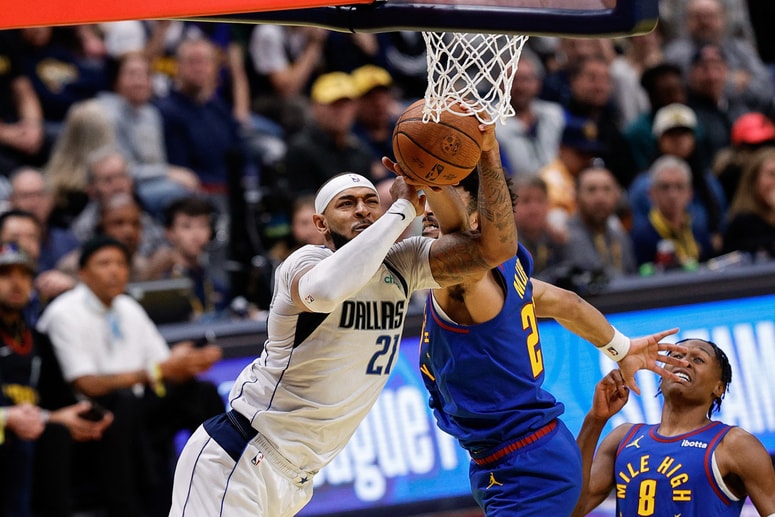 Nov 22, 2024; Denver, Colorado, USA; Dallas Mavericks center Daniel Gafford (21) drives to the net against Denver Nuggets guard Jamal Murray (27) in the fourth quarter at Ball Arena. Mandatory Credit: Isaiah J. Downing-Imagn Images 