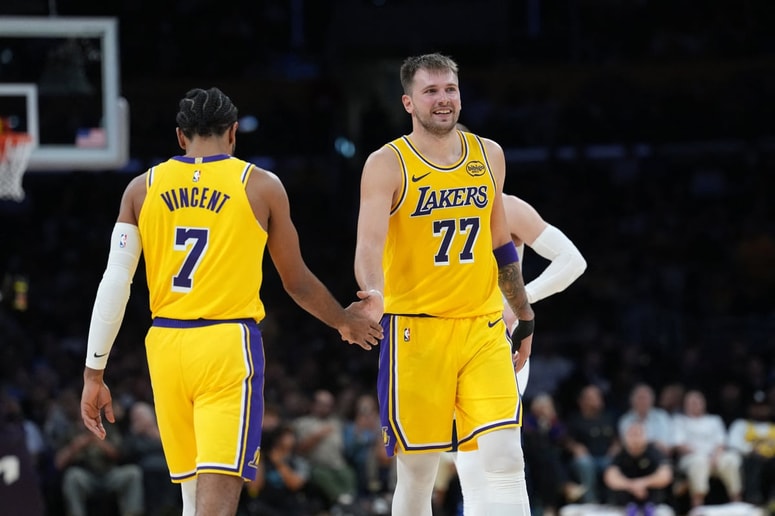 Oct 24, 2025; Los Angeles, California, USA; Los Angeles Lakers guard Luka Doncic (77) celebrates with guard Gabe Vincent (7) in the second half against the Minnesota Timberwolves at Crypto.com Arena. Mandatory Credit: Kirby Lee-Imagn Images 