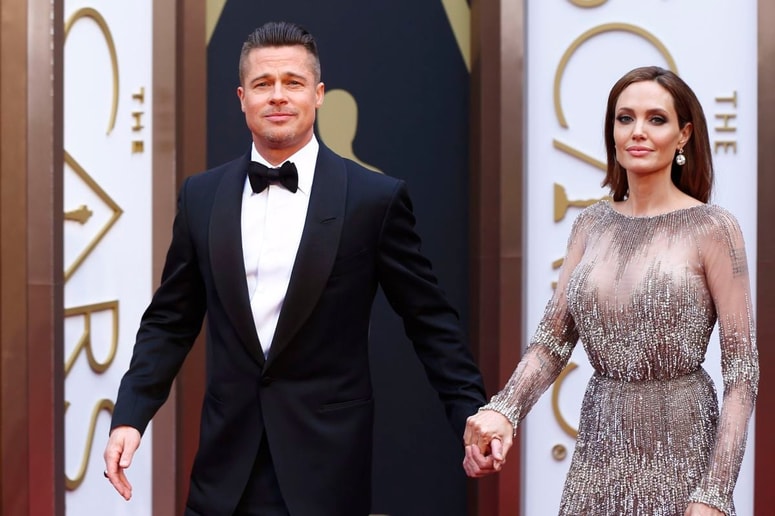 Actor Brad Pitt and actress Angelina Jolie arrive at the 86th Academy Awards in Hollywood, California in this March 2, 2014 file photo. Brad Pitt and Angelina Jolie, the glamorous Hollywood couple dubbed "Brangelina" in tabloid headlines, were married in France, according to media reports on August 28, 2014. REUTERS/Lucas Jackson/Files (UNITED STATES - Tags: ENTERTAINMENT) 